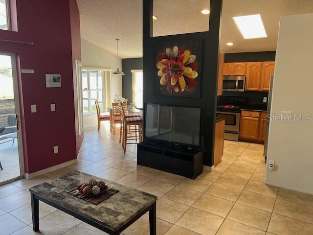 2533 Oneida Loop Kissimmee, FL 34747 - Photo 12 of 73 a living room with furniture and a flat screen tv
