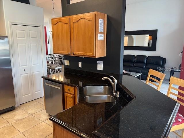 2533 Oneida Loop Kissimmee, FL 34747 - Photo 21 of 73 a kitchen with granite countertop a sink and a stove top oven