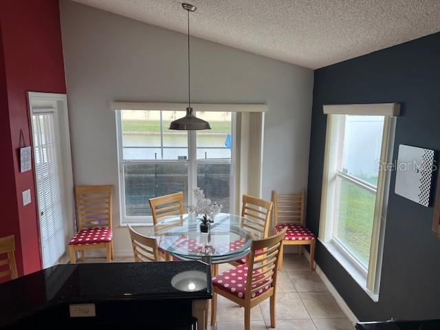 2533 Oneida Loop Kissimmee, FL 34747 - Photo 24 of 73 a living room with furniture and a large window