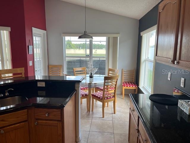 2533 Oneida Loop Kissimmee, FL 34747 - Photo 25 of 73 a kitchen with stainless steel appliances granite countertop sink stove top oven and cabinets