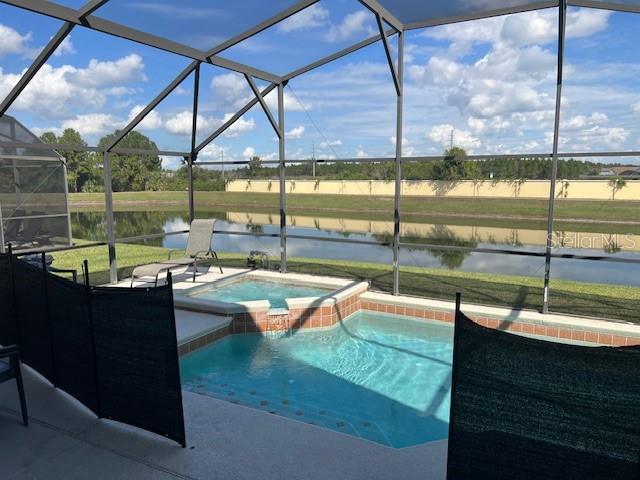 2533 Oneida Loop Kissimmee, FL 34747 - Photo 29 of 73 a view of a swimming pool with a yard