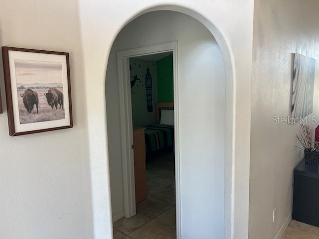 2533 Oneida Loop Kissimmee, FL 34747 - Photo 38 of 73 a view of a hallway with wooden floor and closet