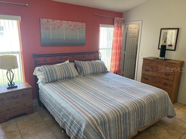 2533 Oneida Loop Kissimmee, FL 34747 - Photo 39 of 73 a bedroom with a bed and a dresser