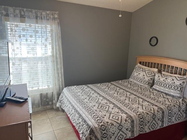 2533 Oneida Loop Kissimmee, FL 34747 - Photo 50 of 73 a bedroom with a bed and a window