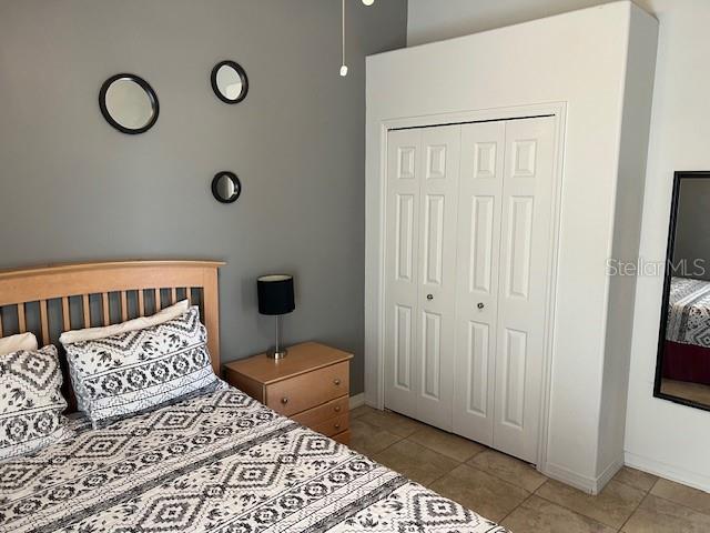 2533 Oneida Loop Kissimmee, FL 34747 - Photo 51 of 73 a bedroom with a bed and a window