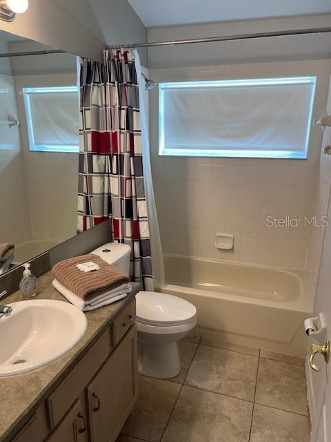 2533 Oneida Loop Kissimmee, FL 34747 - Photo 54 of 73 a bathroom with a sink a toilet and shower