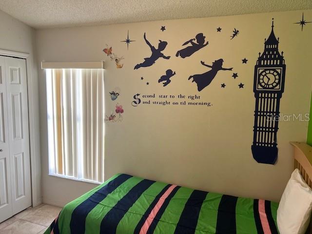 2533 Oneida Loop Kissimmee, FL 34747 - Photo 56 of 73 a bedroom with a bed and a window