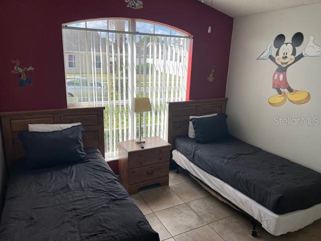 2533 Oneida Loop Kissimmee, FL 34747 - Photo 60 of 73 a living room with furniture and a fireplace