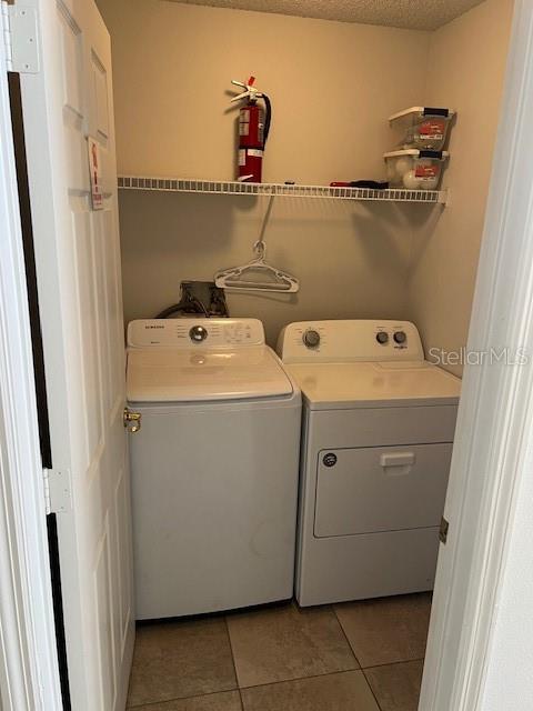2533 Oneida Loop Kissimmee, FL 34747 - Photo 65 of 73 a utility room with dryer and washer