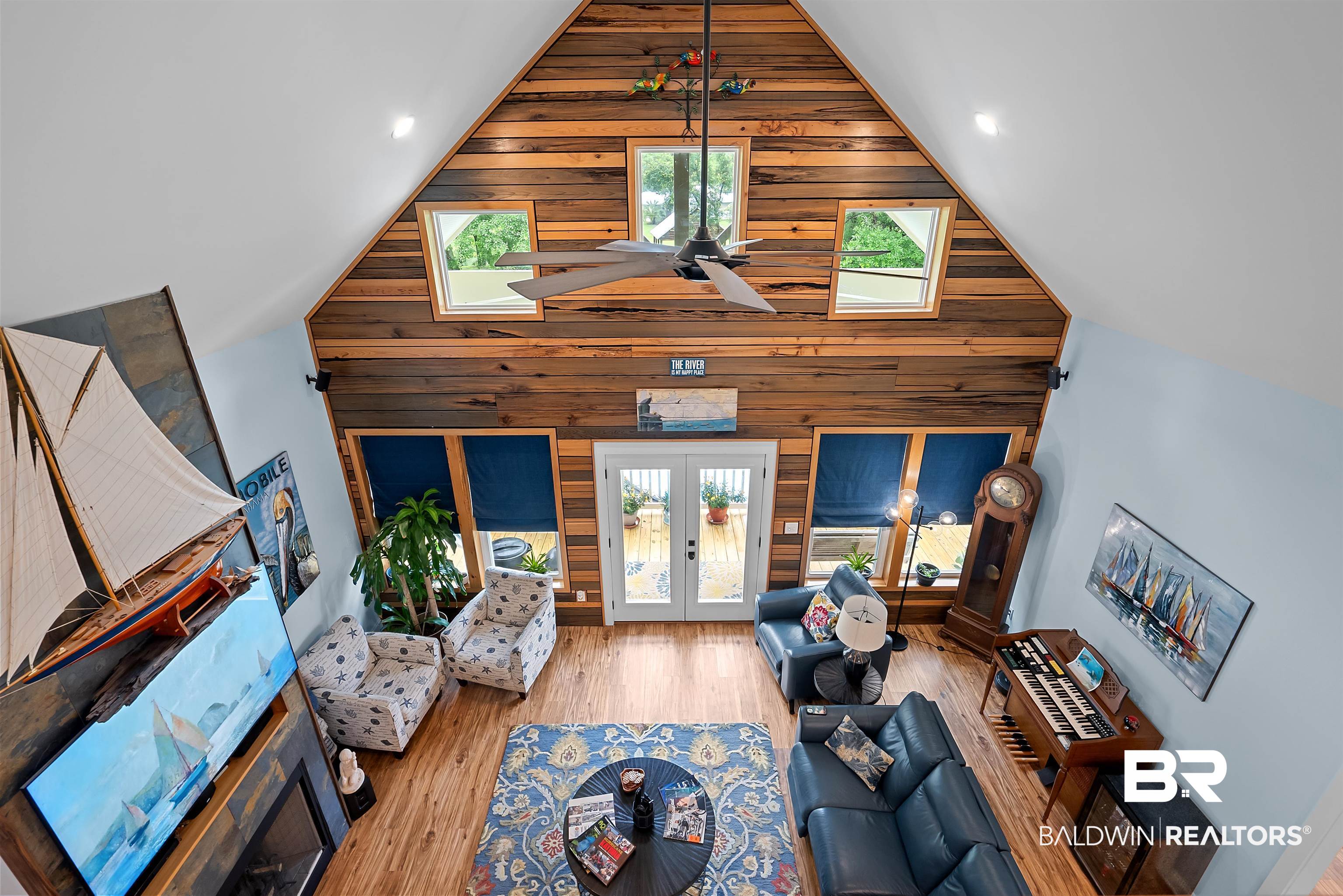 7266 Franklin Road Foley, AL 36535 - Photo 18 of 64 Vaulted ceiling showcasing natural wood paneling, skylights, and a ceiling fan