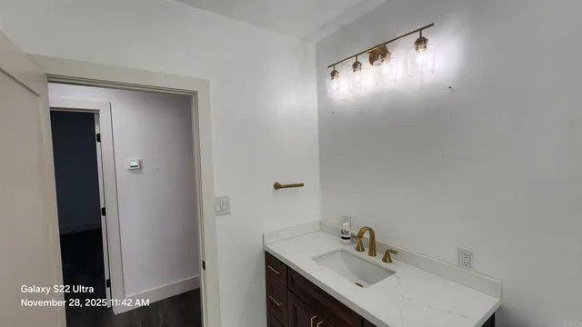 a bathroom with a sink and a mirror
