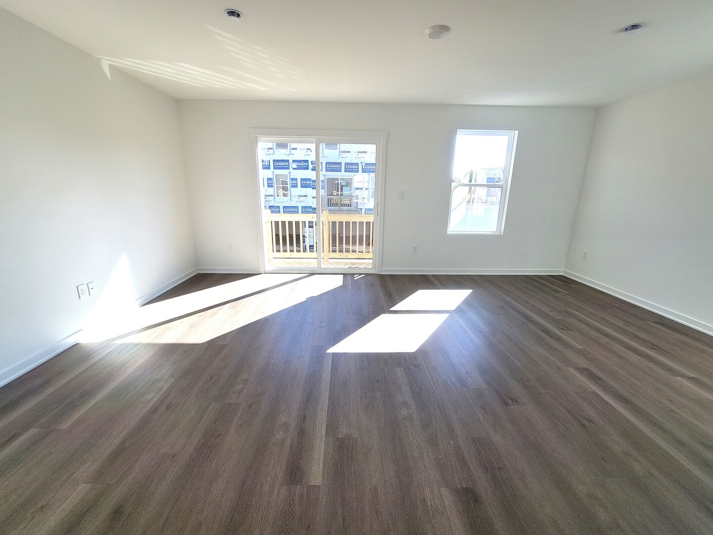 6550 Linden Trail, Unit F Wonder Lake, IL 60097 - Photo 7 of 18 an empty room with wooden floor and windows