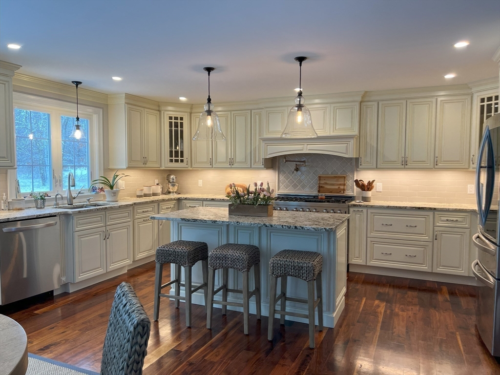 69 Narrows Road Assonet, MA 02702 - Photo 23 of 40 a kitchen with granite countertop white cabinets and appliances