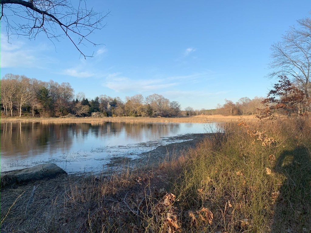69 Narrows Road Assonet, MA 02702 - Photo 33 of 40 a view of a lake with houses in the back