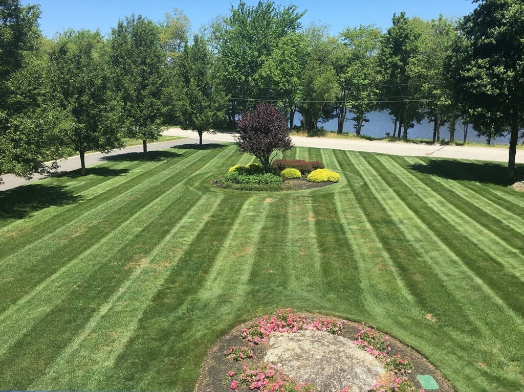 69 Narrows Road Assonet, MA 02702 - Photo 35 of 40 a view of a swimming pool with a garden