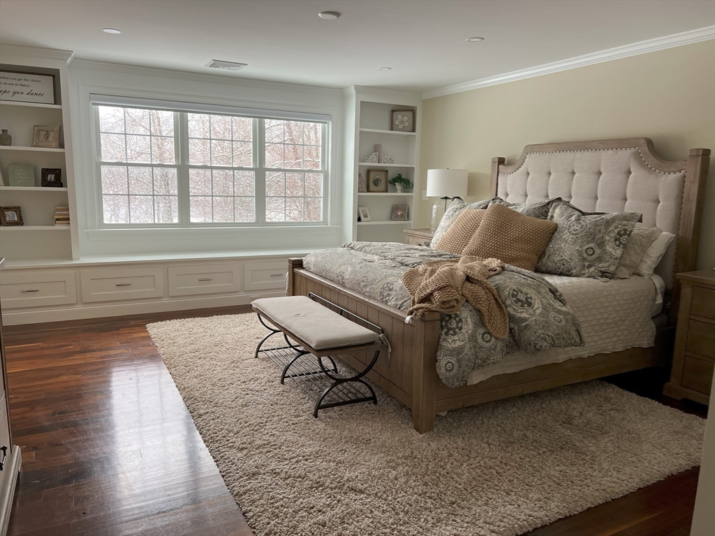 69 Narrows Road Assonet, MA 02702 - Photo 9 of 40 a bed sitting in a bedroom next to a window