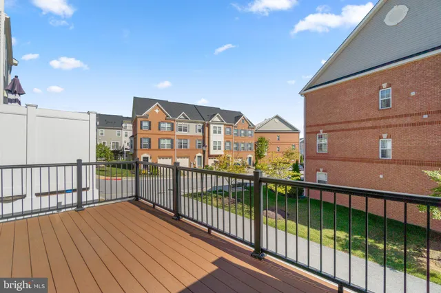 a view of a balcony with wooden floor