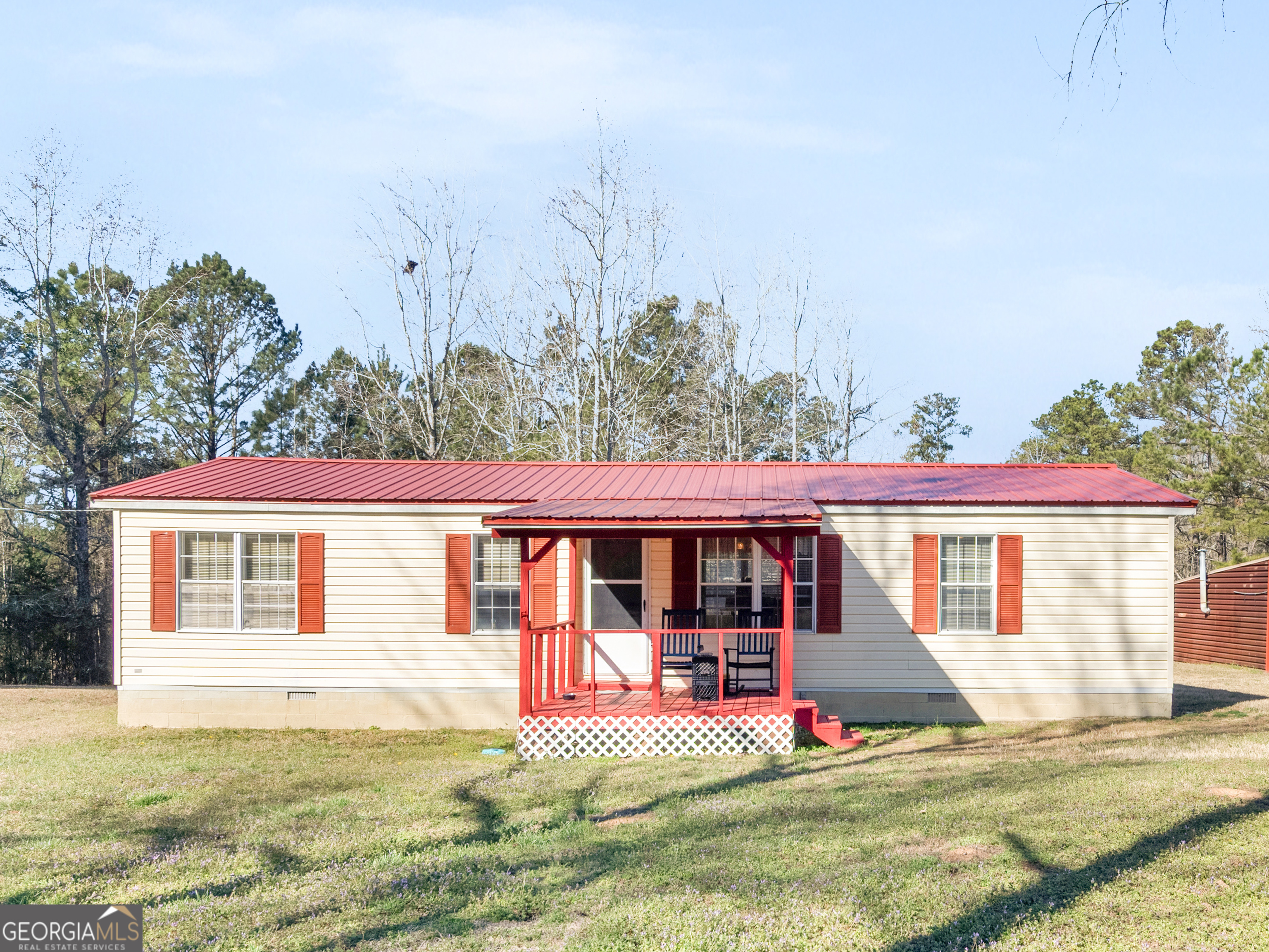 4025 High Falls Road Jackson, GA 30233 - Photo 1 of 1 a view of a house with backyard and sitting area