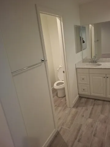 a view of a room with gym equipment and a window