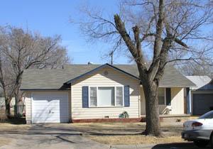 4007 South Jackson Street Amarillo, TX 79110 - Photo 1 of 1 a front view of a house with a yard