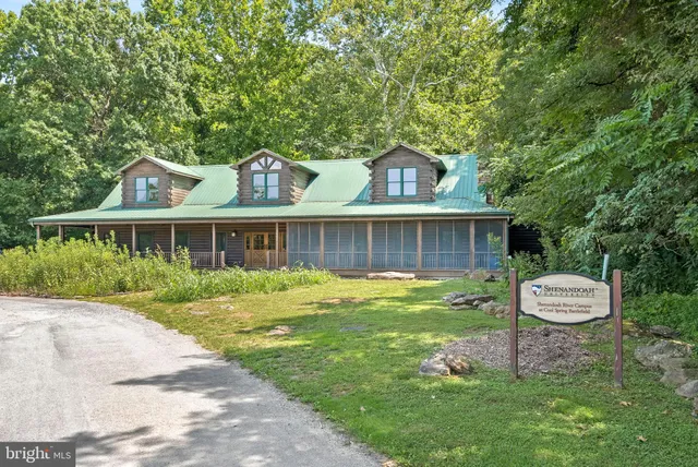 a front view of house with a garden