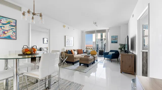 a living room with furniture or couch and a dresser