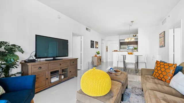 a view of living room with furniture and a flat screen tv