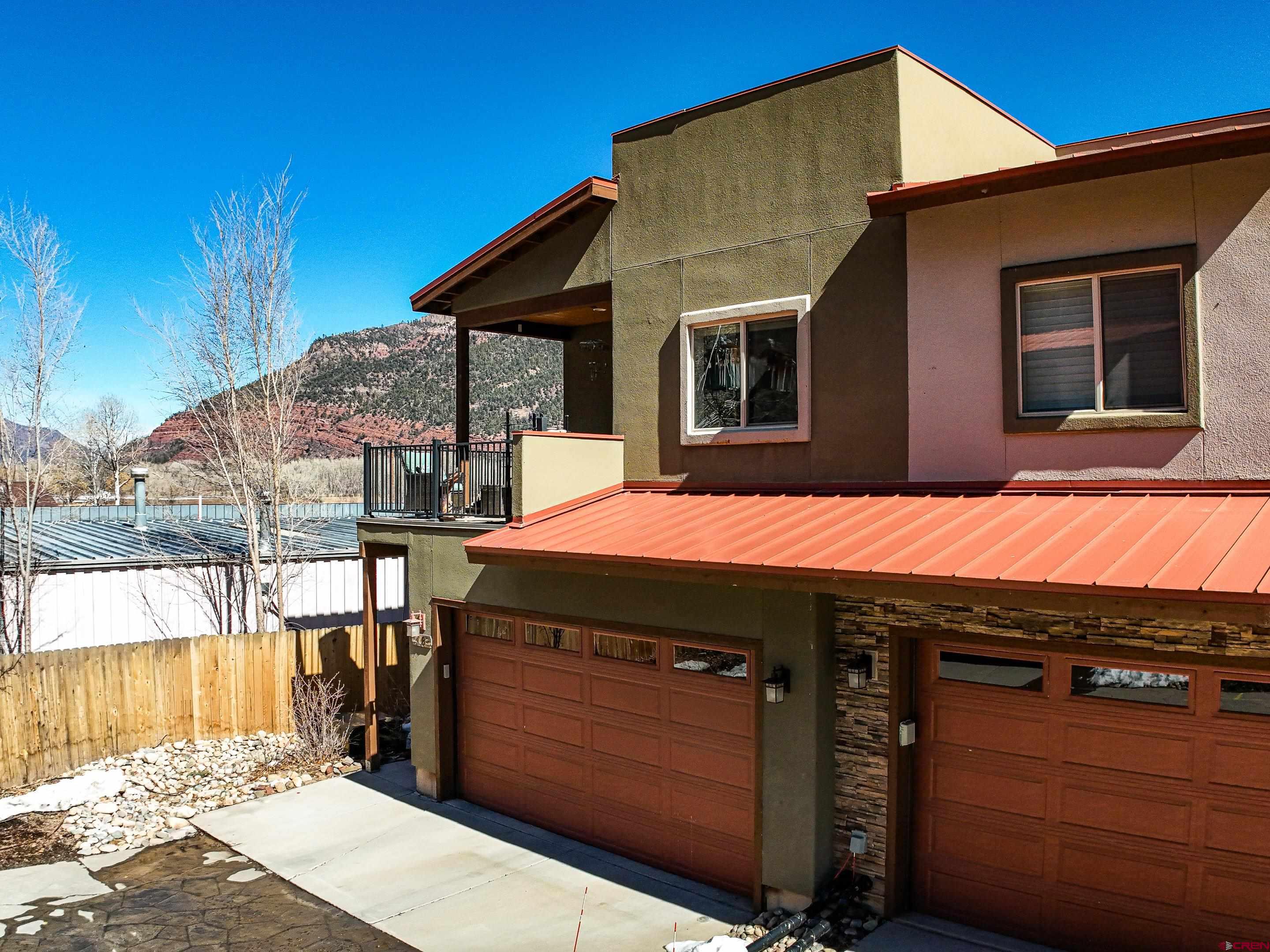 1422 Animas View Drive, Unit 18 Durango, CO 81301 - Photo 1 of 16 a view of a house with a backyard