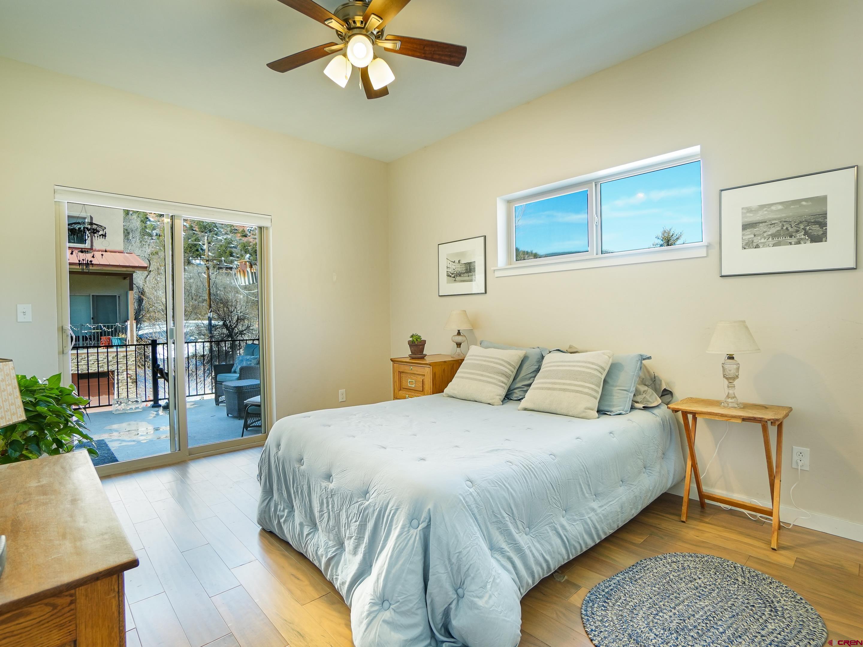 1422 Animas View Drive, Unit 18 Durango, CO 81301 - Photo 14 of 16 a bedroom with a bed lamps and table