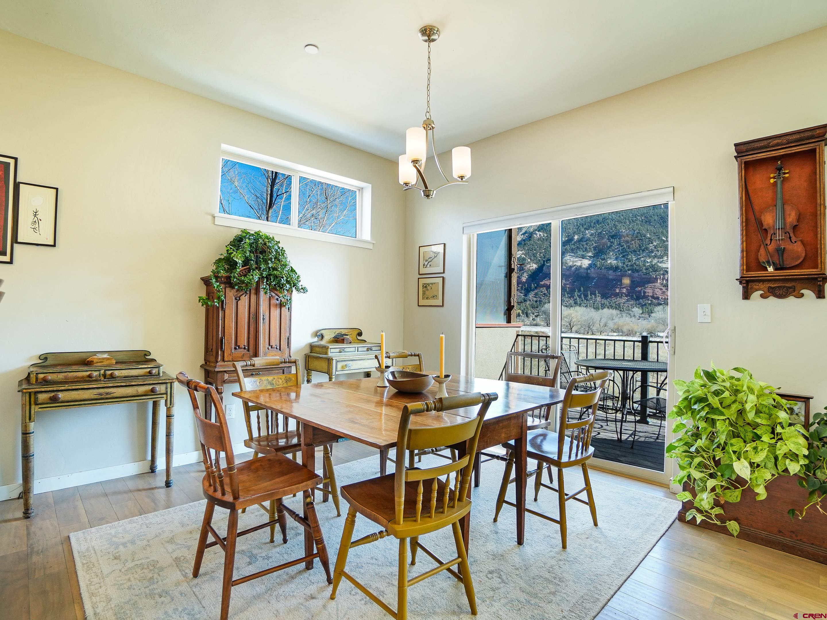 1422 Animas View Drive, Unit 18 Durango, CO 81301 - Photo 5 of 16 a dining room with furniture and window