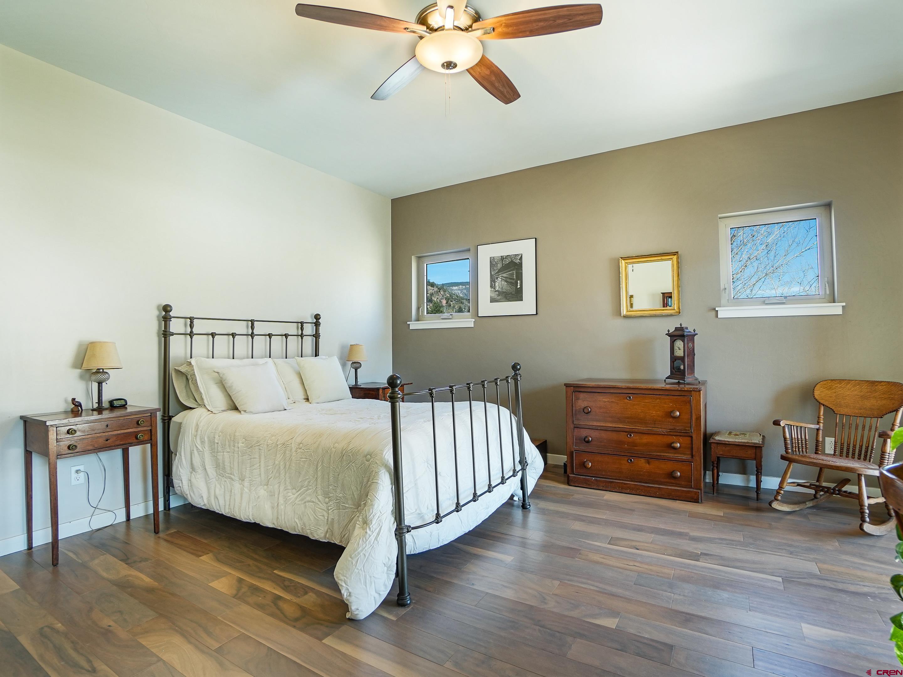 1422 Animas View Drive, Unit 18 Durango, CO 81301 - Photo 10 of 16 a bedroom with a bed and a chandelier