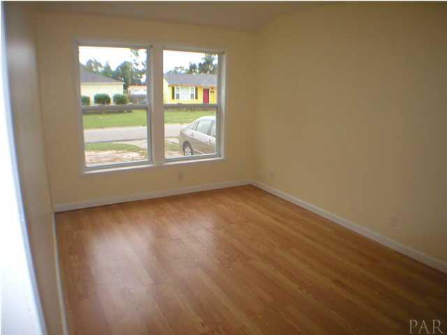 218 Bryant Road Pensacola, FL 32507 - Photo 10 of 13 Bonus room/sunroom with laminate flooring