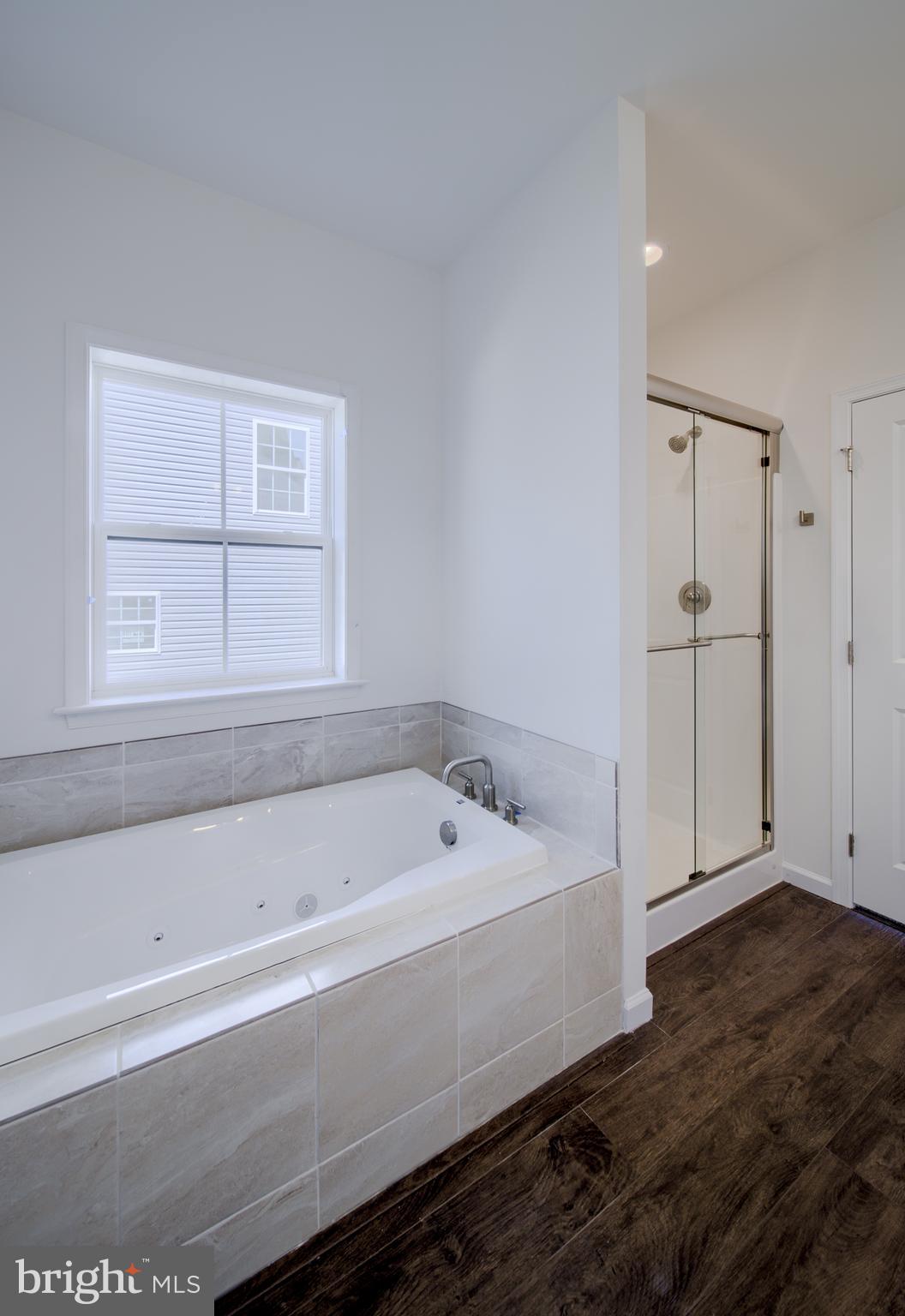 3145 East Joppa Road, Unit MILTON Parkville, MD 21234 - Photo 13 of 13 a bathroom with a bathtub and a window