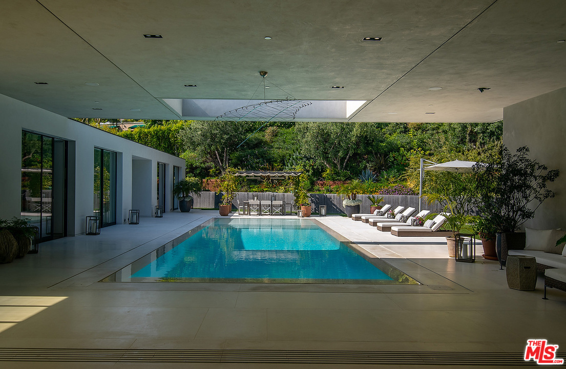 1012 North Hillcrest Road Beverly Hills, CA 90210 - Photo 52 of 54 a view of swimming pool with seating space