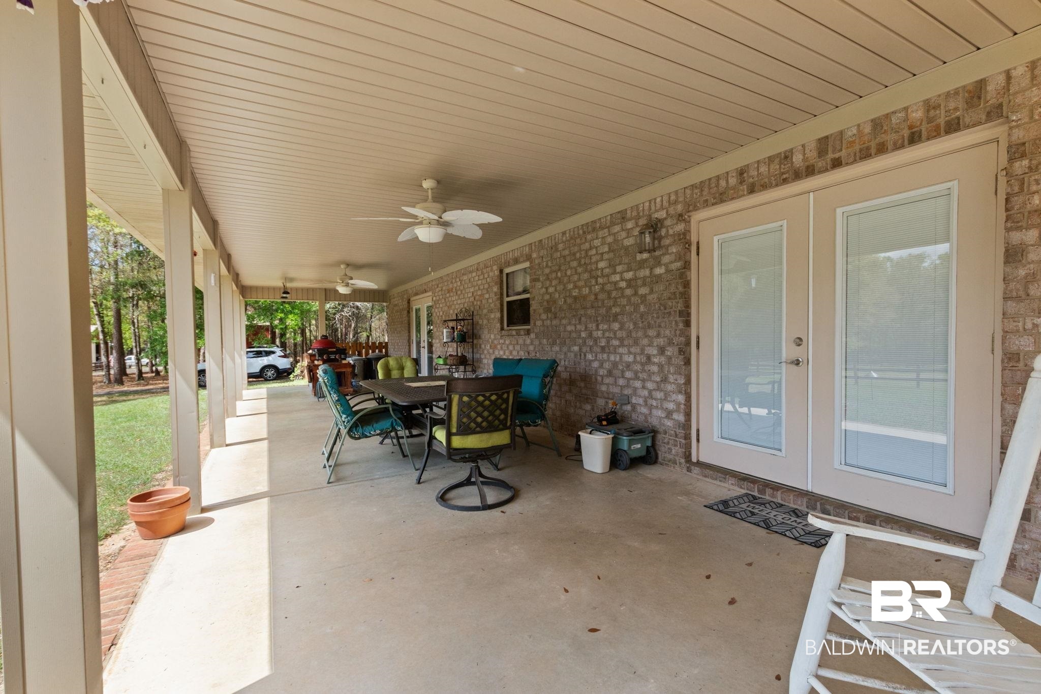 24250 Hack Road Bay Minette, AL 36507 - Photo 62 of 88 View of patio / terrace featuring french doors, outdoor dining area, and ceiling fan