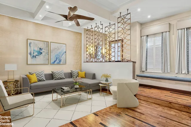 a living room with furniture and a window