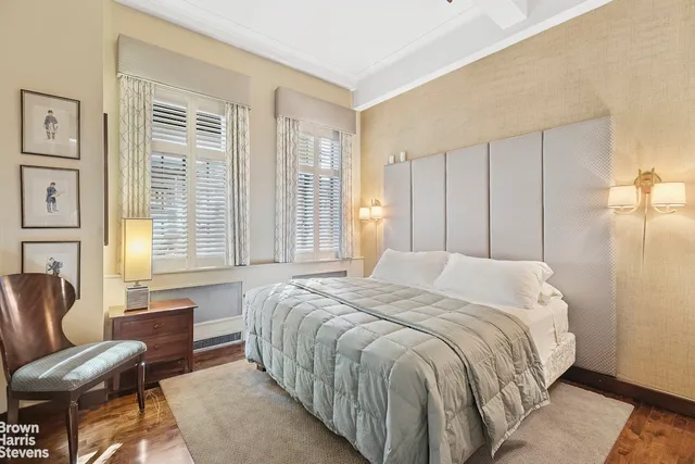 a spacious bedroom with a bed and a couch