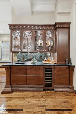 a kitchen with appliances a sink and cabinets