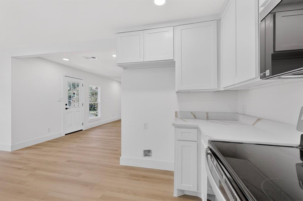 2219 Wilbur Street Dallas, TX 75224 - Photo 12 of 37 a view of cabinets and oven