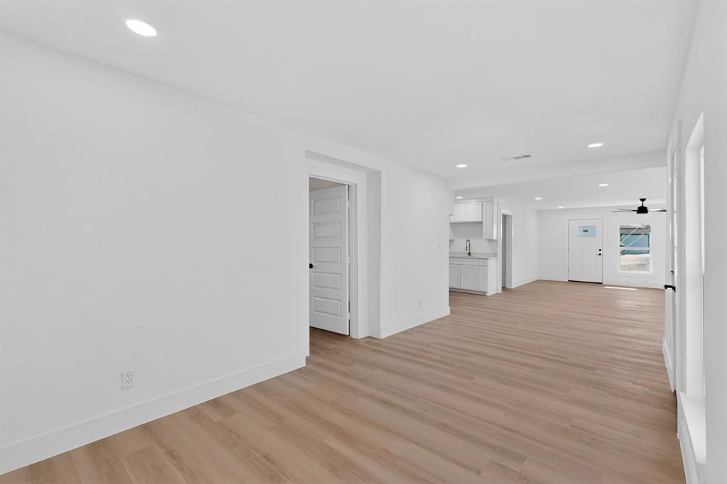 2219 Wilbur Street Dallas, TX 75224 - Photo 14 of 37 a view of empty room with wooden floor