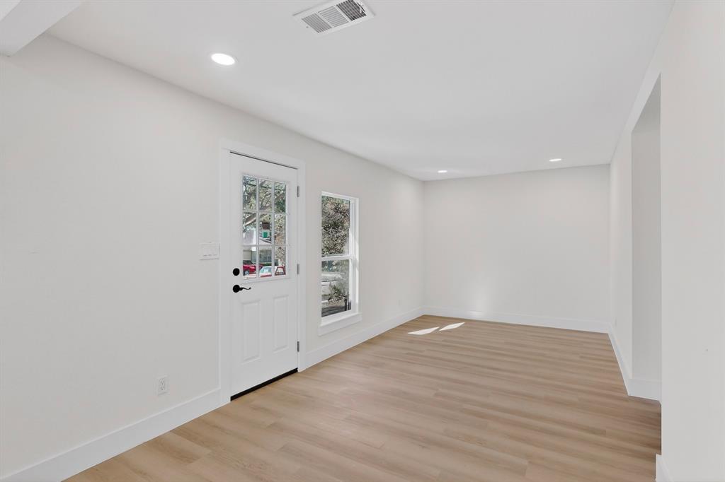 2219 Wilbur Street Dallas, TX 75224 - Photo 15 of 37 an empty room with windows