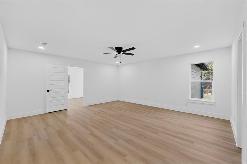 2219 Wilbur Street Dallas, TX 75224 - Photo 20 of 37 wooden floor in an empty room with a window
