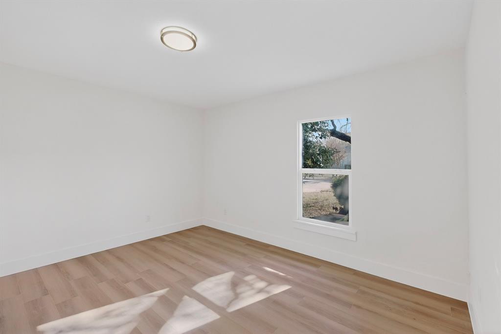 2219 Wilbur Street Dallas, TX 75224 - Photo 27 of 37 a view of empty room with wooden floor