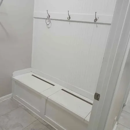 a view of a storage & utility room with racks on the wall