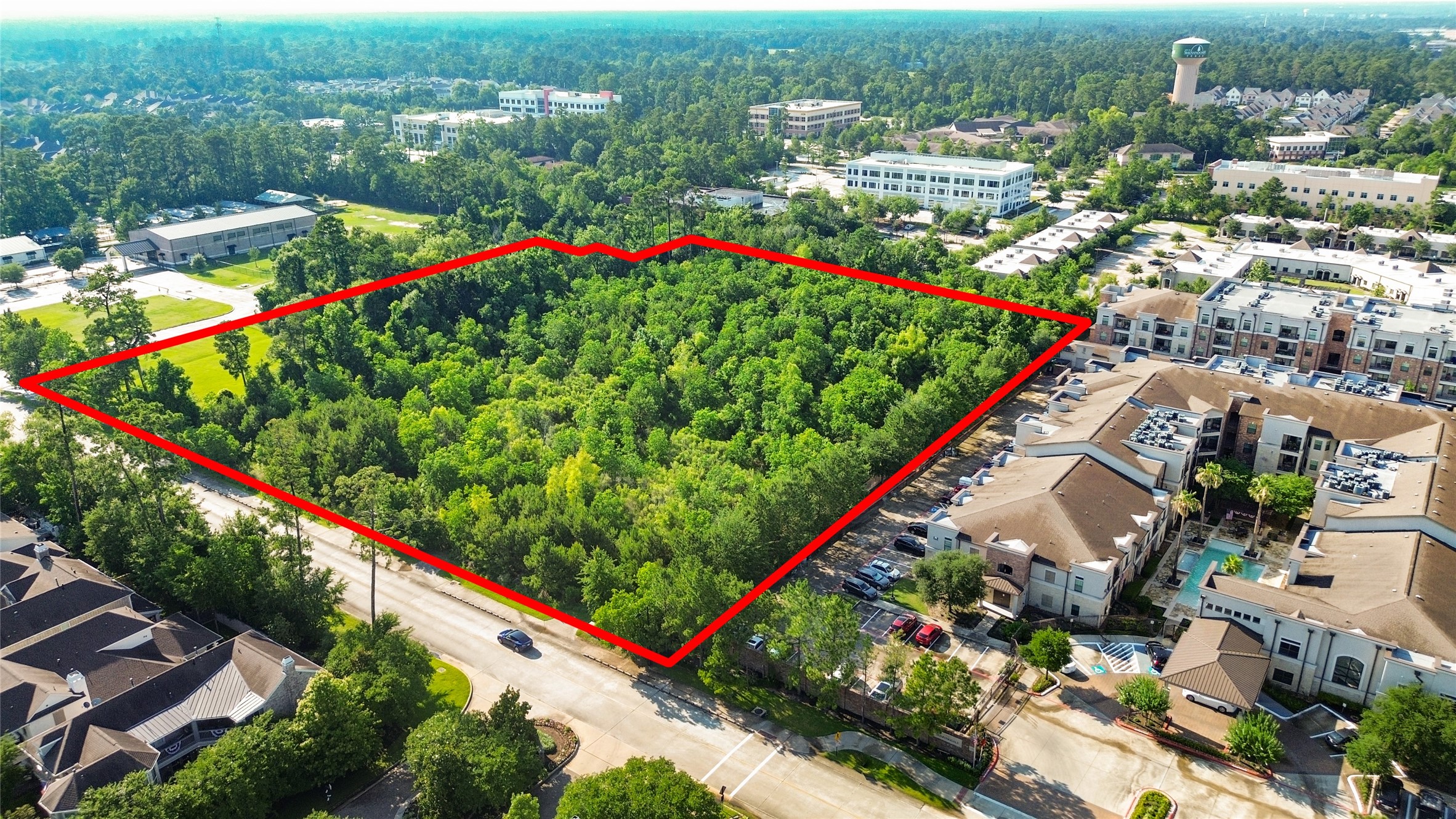 1120 Wellman Road Conroe, TX 77384 - Photo 2 of 7 an aerial view of a city and mountain view
