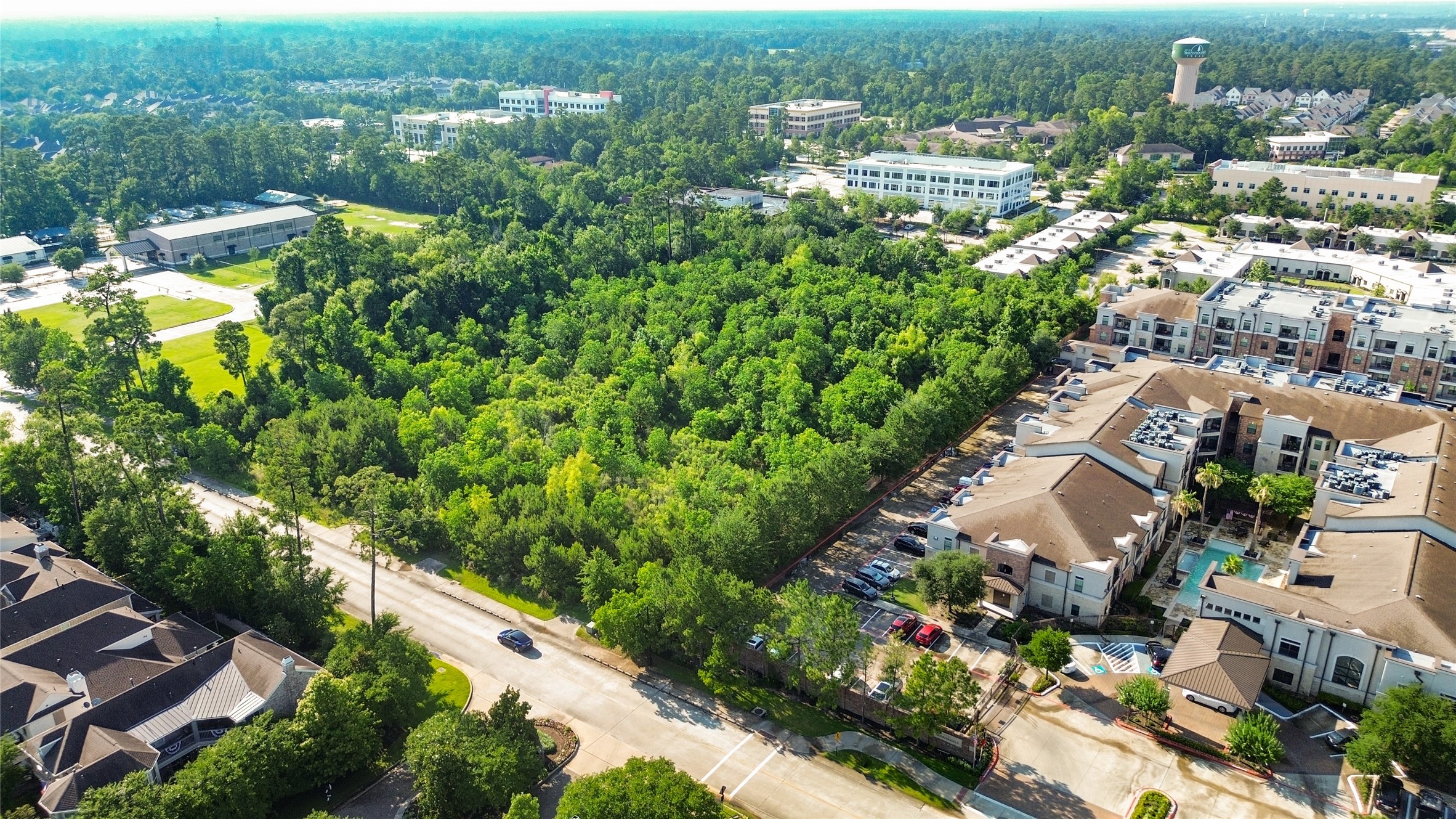 1120 Wellman Road Conroe, TX 77384 - Photo 4 of 7 an aerial view of residential houses with outdoor space