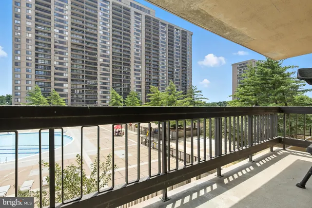 a view of balcony with floor to ceiling window and wooden floor