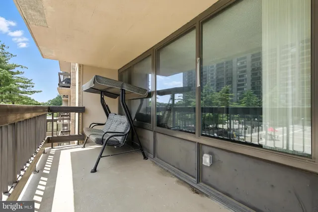 a view of a balcony with chairs