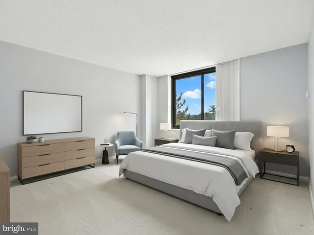 a bedroom with a bed and window