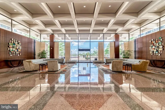 a view of swimming pool with an outdoor seating